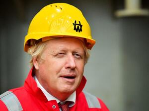 Britain's Prime Minister Boris Johnson gestures during his visit to Appledore Shipyard in south west England on August 25, 2020, as the historic shipyard announced it's re-opening having being bought by InfraStrata in a £7 million deal. Ben Birchall / POOL / AFP