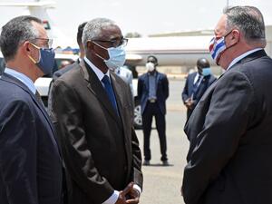 US Secretary of State Mike Pompeo (R) is welcomed by a Sudanese official in Khartoum on August 25, 2020. Pompeo is on an official visit to Sudan to urge more Arab countries to normalise ties with Israel, following the US-brokered Israel-UAE agreement. He is the first American top diplomat to visit Sudan since Condoleezza Rice went in 2005.  AFP