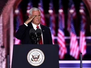 US Vice President Mike Pence salutes after speaking during the third night of the Republican National Convention at Fort McHenry National Monument in Baltimore, Maryland, August 26, 2020. SAUL LOEB / AFP