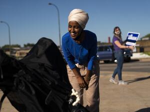 Rep. Ilhan Omar (D-MN) greets Isabel Aarts in her stroller during a campaign stop on August 11, 2020 in Minneapolis, Minnesota. (Stephen Maturen / GETTY IMAGES NORTH AMERICA / Getty Images via AFP)