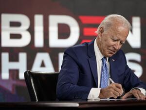 Presumptive Democratic presidential nominee former Vice President Joe Biden signs required documents for receiving the Democratic nomination for President at the Hotel DuPont on August 14, 2020 in Wilmington, Delaware. (AFP/File)