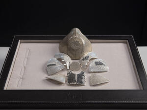 The mask is constructed with 18-karat white gold mask will be decorated with 3,600 white and black diamonds. (Twitter)