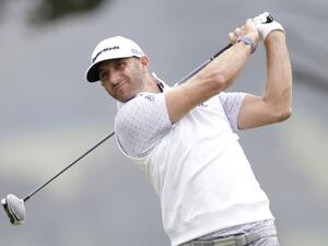 Dustin Johnson hits a tee shot on the 4th hole in the third round of the 102nd PGA Championship on Saturday at TPC Harding Park in San Francisco. (Photo: John Angelillo/UPI)