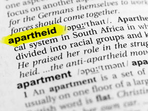 Highlighted English word "apartheid" and its definition in the dictionary. (Shutterstock/ File Photo)