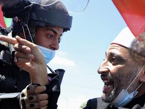 A Palestinian demonstrator argues with Israeli security forces during a rally to protest against Israel's plan to annex parts of the occupied West Bank, in the village of Haris, southwest of Nablus, on August 21, 2020. JAAFAR ASHTIYEH / AFP