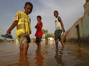 Sudanese boys make their way through a flooded street at the area of al-Qamayir in the capital's twin city of Omdurman, on August 26, 2020. Sudan on September 5 declared the imposition of a three-month state of emergency nationwide after record-breaking torrential floods caused by more than a month heavy rains left dozens dead and 100,000 damaged properties in their wake, in one of the worst natural disasters in decades, according to state news agency SUNA. ASHRAF SHAZLY / AFP Sudanese boys make their way through a flooded street at the area of al-Qamayir in the capital's twin city of Omdurman, on August 26, 2020. Sudan on September 5 declared the imposition of a three-month state of emergency nationwide after record-breaking torrential floods caused by more than a month heavy rains left dozens dead and 100,000 damaged properties in their wake, in one of the worst natural disasters in decades, according to state news agency SUNA. ASHRAF SHAZLY / AFP