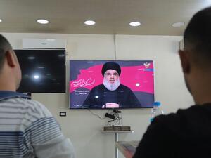 Lebanese men watch the head of the country's Shiite Muslim movement Hezbollah Hassan Nasrallah during a televised speech, at a coffee shop in the southern suburbs of the capital Beirut, on August 30, 2020, on the tenth day of the month of Muharram which marks the peak of Ashura. Ashura is a 10-day period of mourning in remembrance of the seventh-century martyrdom Imam Hussein, who was killed in the battle of Karbala in modern-day Iraq, in 680 AD. ANWAR AMRO / AFP