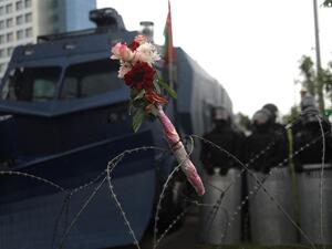 Flowers attached to a barbed wire fence during a rally to protest against the disputed August 9 presidential elections results in Minsk on September 6, 2020. Tens of thousands of Belarusians staged a peaceful new march on September 6, keeping the pressure on strongman Alexander Lukashenko who has refused to quit after his disputed re-election and turned to Russia for help to stay in power. TUT.BY / AFP