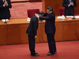 Chinese medical expert Zhong Nanshan (L) receives an award from Chinese President Xi Jinping during a ceremony to honour people who fought against the COVID-19 coronavirus pandemic, at the Great Hall of the People in Beijing on September 8, 2020. NICOLAS ASFOURI / AFP