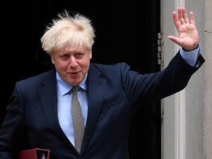 Britain's Prime Minister Boris Johnson waves as he leaves 10 Downing Street in central London on September 9, 2020, to attend Prime Minister's Questions (PMQs) at the House of Commons. Ben STANSALL / AFP