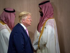 In this file photo US President Donald Trump and Saudi Arabia's Crown Prince Mohammed Bin Salman (R) arrive for a meeting on "World Economy" at the G20 Summit in Osaka on June 28, 2019. US President Donald Trump boasted that he saved Saudi Arabia's crown prince from greater scrutiny over the killing of journalist Jamal Khashoggi, according to an explosive new book. In one of 18 interviews with legendary investigative reporter Bob Woodward, Trump defended Mohammed bin Salman over the gruesome murder inside a