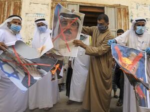 Palestinian men burn the exed out portraits of the Bahraini King, US President and Israeli Premier during a protest in Deir al-Balah, in central Gaza Strip, on September 12, 2020, to condemn the normalisation of ties between Israeli and Bahrain. The Palestinian cause has long cemented ties between Middle East nations with divergent interests, but amid shifting regional alliances they are increasingly isolated and in need of new friends, analysts say. In the latest blow, Bahrain broke ranks and agreed on Fri