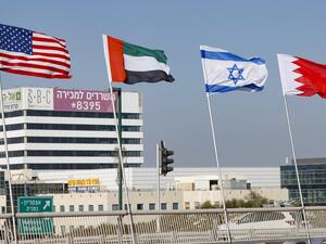 The flags of (L-R) the US, the United Arab Emirates, Israel and Bahrain are flown along a road, in the resort city of Netanya in central Israel, on September 13, 2020. The UAE and Bahrain will sign agreements to recognise Israel, on September 15. US President Donald Trump and Israeli Prime Minister Benjamin Netanyahu are to sign the Abraham accords -- a reference to the common traditions of Islam, Judaism and Christianity -- at a White House ceremony. JACK GUEZ / AFP