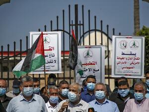 Demonstrators, mask-clad due to the COVID-19 coronavirus pandemic, attend a protest against the United Arab Emirates' and Bahrain's decisions to normalise relations with Israel, in Gaza City on September 15, 2020. Mohammed ABED / AFP