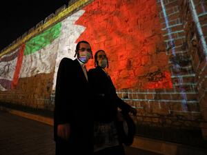The flags of US, Israel, United Arab Emirates, and Bahrain are projected on the ramparts of Jerusalem's Old City on September 15, 2020 in a show of support for Israeli normalisation deals with the United Arab Emirates and Bahrain. The decision by the UAE and Bahrain to normalise ties with Israel breaks with decades of consensus within the Arab world that a peace deal with the Palestinians is a prerequisite for establishing relations with the Jewish state. menahem kahana / AFP