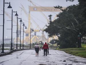Residents walk on the costal road hours before Hurricane Sally makes landfall on the US Gulf Coast in Pascagoula, Mississippi on September 15, 2020. CHANDAN KHANNA / AFP