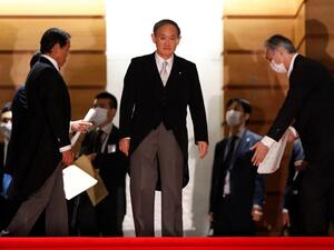 Japan's new Prime Minister Yoshihide Suga (C) leads his cabinet ministers for a photo session at prime minister's official residence in Tokyo on September 16, 2020. Yoshihide Suga became Japan's new prime minister on September 16, with the former chief cabinet secretary expected to stick closely to policies championed by Shinzo Abe during his record-breaking tenure. ISSEI KATO / POOL / AFP
