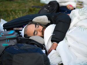 This picture taken on September 16, 2020 shows Jewish pilgrims stuck between Belarusian and Ukrainian border crossings. Hundreds of Hasidic Jews were still massed at Ukraine's border, with some saying they had no intention of leaving, even though Kiev has refused their entry citing coronavirus and Israel has urged them to return. Tens of thousands of Hasidic Jews head to the central Ukrainian city of Uman every Jewish New Year -- which falls on September 18-20 this year -- to visit the tomb of Rabbi Nahman,