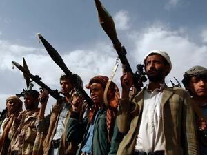 Houthi rebels gather on the outskirts of Sanaa in June 2016 (AFP)