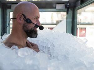 Austrian sportsman Josef Koeberl stands still in an ice-filled glass cabin as he tries to set a World Record of staying in ice. (Twitter)