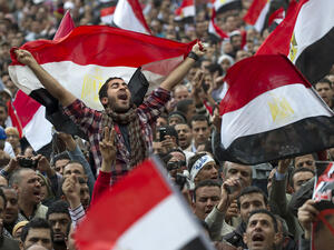 Egyptian anti-goverment demonstrators wave Egyptian flags at Cairo's Tahrir Square on February 10, 2011 on the 17th day of protests against President Hosni Mubarak's regime. (AFP/File)
