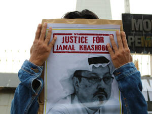Humanitarian activists hold a poster with a picture of Jamal Khashoggi demonstrating in Makassar. (Shutterstock/ File Photo)
