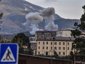Smoke rises after shelling in Stepanakert on October 9, 2020, during ongoing fighting between Armenia and Azerbaijan over the disputed region of Nagorno-Karabakh. ARIS MESSINIS / AFP