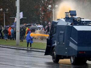 Police use a water cannon truck to disperse demonstrators during a rally to protest against the Belarus presidential election results in Minsk on October 11, 2020. Riot police swiftly detained dozens at a protest march in Belarus on October 11 after strongman leader raised hopes for change by meeting jailed opposition figures. STRINGER / AFP