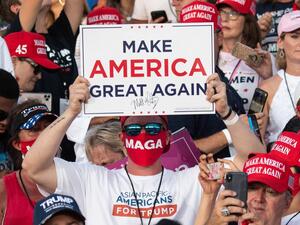Supporters of US President Donald Trump attend a Make America Great Again rally as he campaigns at Orlando Sanford International Airport in Sanford, Florida, October 12, 2020. SAUL LOEB / AFP