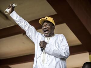 Current President and presidential candidate, Alpha Conde addresses his supporters at a campaign rally in Conakry on October 16, 2020. The President is bidding for a third term in office with the presidential elections to be held on October 18, defying critics who say he forced through a new constitution this year enabling him to sidestep two-term presidential limits. JOHN WESSELS / AFP