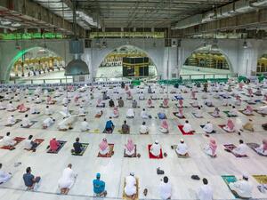 Saudi Arabia opened Islam's holiest site for prayers for the first time in seven months, and expanded the umrah pilgrimage to accommodate 15,000 worshippers as it relaxed coronavirus curbs. STR / AFP