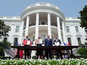 (L-R) Bahraini Foreign Minister Abdullatif al-Zayani, Israeli Prime Minister Benjamin Netanyahu, US President Donald Trump, and UAE Foreign Minister Abdullah bin Zayed Al-Nahyan hold up documents after participating in the signing of the Abraham Accords where the countries of Bahrain and the United Arab Emirates recognize Israel, at the White House in Washington, DC. (AFP)