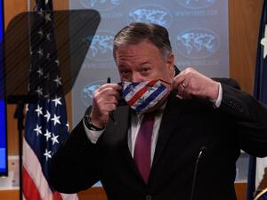 US Secretary of State Mike Pompeo puts on a facemask after a press conference at the State Department in Washington, DC, on October 21, 2020. US Secretary of State Mike Pompeo said Wednesday he hoped Sudan will soon recognize Israel as Washington moved to remove the Arab country as a state sponsor of terrorism."We continue to work to make the case to every country to recognize Israel," Pompeo told reporters.  NICHOLAS KAMM / POOL / AFP