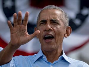 Former US President Barack Obama speaks at a Biden-Harris drive-in rally in Orlando, Florida on October 27, 2020. Ricardo ARDUENGO / AFP