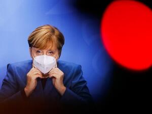 German Chancellor Angela Merkel wears a face mask as she leaves after a news conference on new coronavirus restrictions following consultations with the premiers of Germany's 16 federal states at Chancellery in Berlin on October 28, 2020. FABRIZIO BENSCH / POOL / AFP
