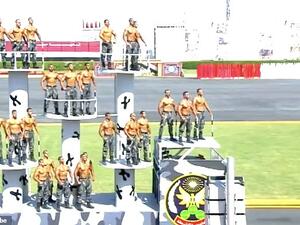 Rows of men with rows of muscles: New police cadets in Egypt put on a show of strength in a topless parade at a graduation ceremony outside Cairo on Thursday. (YouTube)