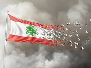 Lebanon flag on a pole turn to birds while waving against a background of smoke. Blast scene on the Lebanese capital of Beirut  (Shutterstock) 