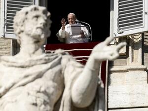 Pope Francis blesses worshippers as he delivers the Sunday Angelus prayer from the window of his study overlooking St.Peter's Square, at the Vatican on November 1, 2020 during the Covid-19 pandemic, caused by the novel coronavirus. Filippo MONTEFORTE / AFP