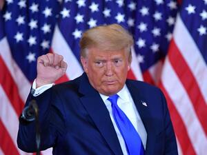 US President Donald Trump pumps his fist after speaking during election night in the East Room of the White House in Washington, DC, early on November 4, 2020. MANDEL NGAN / AFP