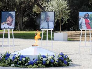 This picture taken on November 7, 2020, in Nice, during a ceremony shows the portraits of the three victims of an attack at Notre-Dame de Nice Basilica on October 29, 2020, (fromL) Nadine Devillers, Vincent Loques and Simone Barreto Silva. (AFP)
