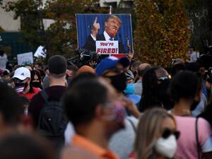 Supporters of president-elect Joe Biden celebrates on Black Lives Matter plaza across from the White House in Washington, DC on November 7, 2020, after Joe Biden was declared the winner of the 2020 presidential election. (AFP/File Photo)