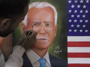 A painter gives the final touches to a painting depicting newly elected US President Joe Biden, in Amritsar on November 8, 2020. NARINDER NANU / AFP A painter gives the final touches to a painting depicting newly elected US President Joe Biden, in Amritsar on November 8, 2020. NARINDER NANU / AFP