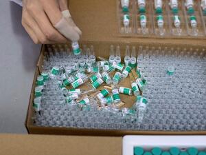 This file photo taken on June 9, 2020 shows a worker packaging rabies vaccine at a lab at the Yisheng Biopharma company, where researchers are trying to develop a vaccine for the Covid-19 coronavirus, in Shenyang, in China's northeast Liaoning province. Noel CELIS / AFP