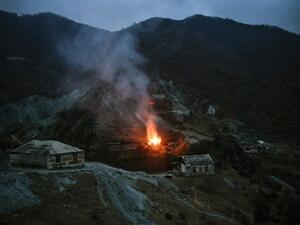 A house burns in a village outside the town of Kalbajar, on November 14, 2020, after a peace agreement was signed to end the military conflict between Armenia and Azerbaijan over the disputed Nagorno-Karabakh region. Villagers outside of Nagorno-Karabakh set their homes on fire on November 11 before fleeing to Armenia ahead of a weekend deadline that will see some disputed territory handed over to Azerbaijan as part of a peace agreement. Residents of the Kalbajar district in Azerbaijan, which has been contr