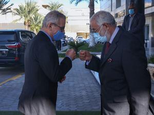 Foreign Minister of Libya's UN-recognised Government of National Accord (GNA) Mohamed Taha Siala (R) and his Maltese counterpart Evarist Bartolo bump fists ahead of a meeting in the capital Tripoli, on November 16, 2020. AFP