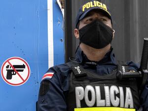 A policeman stands guard at the Congress building during a protest against the government's motion to increase taxes in order to reach a credit agreement with the International Monetary Fund (IMF), in San Jose, on November 18, 2020. Ezequiel BECERRA / AFP