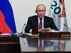 Russian President Vladimir Putin attends the G20 summit hosted by Saudi Arabia via video conference at the Novo-Ogaryovo state residence, outside Moscow, Russia, on November 21, 2020. AFP