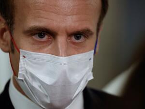 French President Emmanuel Macron listens during a visit to the 2020 Phoneton, an annual fundraising operation organised by the Hayastan All-Armenian Fund's French affiliate (Fonds Armenien de France) for the development of Armenia and Artsakh, on November 21, 2020 in Paris. Ludovic MARIN / POOL / AFP