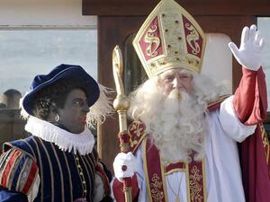 Sinterklaas, the Dutch Santa Claus, has a contentious helper in the Netherlands. "Zwarte Piet" or Black Pete has a painted black face, bright red-colored lips and a curly Afro wig. (AFP)