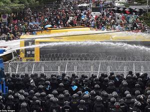 Thai riot police blasted protesters with water cannon and used teargas today, hurting several people in a bid to push back a demonstration at parliament demanding constitutional changes that would touch on the powerful monarchy.   Protesters are demanding changes to the constitution drawn up by Thailand's former junta. They also want the removal of Prime Minister Prayuth Chan-ocha, a former army ruler, and reforms to curb the powers of the monarchy. (AFP/File Photo)